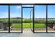 Enjoy outdoor living with a screened-in patio overlooking the lush green yard at 454 Bouchelle Dr # 102, New Smyrna Beach, FL 32169