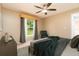 Inviting bedroom with a window view and comfortable seating, perfect for relaxation and natural light at 4623 Secret River Trl, Port Orange, FL 32129