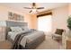 Comfortable bedroom with ceiling fan, woven blinds, and contemporary decor at 4623 Secret River Trl, Port Orange, FL 32129