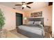 Comfortable bedroom featuring a ceiling fan, closet, and serene decor, creating a relaxing atmosphere at 4623 Secret River Trl, Port Orange, FL 32129