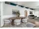 Bright dining room with modern table and seating adjoins the spacious living room at 4623 Secret River Trl, Port Orange, FL 32129