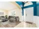Bright and inviting entryway with wood floors and a view into the living area at 4623 Secret River Trl, Port Orange, FL 32129