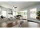Cozy living room with lots of natural light, fan, and sliding doors to lanai at 4623 Secret River Trl, Port Orange, FL 32129