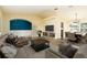 Open-concept living space featuring a neutral color palette and seamless flow to the dining area at 4623 Secret River Trl, Port Orange, FL 32129