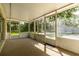 Spacious screened porch with a view of the lush backyard, ideal for outdoor relaxation and entertaining at 4623 Secret River Trl, Port Orange, FL 32129