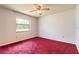 Cozy bedroom with a single window bringing in natural light at 5060 Audubon Ave, De Leon Springs, FL 32130