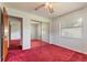 Bedroom featuring sliding mirror closet doors with a view into another room at 5060 Audubon Ave, De Leon Springs, FL 32130