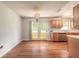Dining room with laminate flooring and French doors leading to the backyard at 5060 Audubon Ave, De Leon Springs, FL 32130