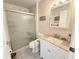 Bright bathroom featuring a tiled walk-in shower and a white vanity with ample storage at 51 Fore Dr, New Smyrna Beach, FL 32168