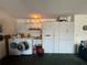 Laundry area features a washer, a dryer, storage cabinets and a utility sink at 51 Fore Dr, New Smyrna Beach, FL 32168