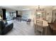 Open-concept living and dining area with lots of seating and natural light from the skylights at 51 Fore Dr, New Smyrna Beach, FL 32168