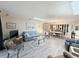 Living room with seating, a ceiling fan, and skylights that fill the room with natural light at 51 Fore Dr, New Smyrna Beach, FL 32168