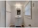 Bathroom with a vanity, framed mirror, and modern lighting above at 514 Mary Ave, New Smyrna Beach, FL 32168
