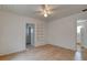 Bedroom showcasing wood-look floors, a ceiling fan, and an open closet at 514 Mary Ave, New Smyrna Beach, FL 32168