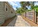 Side view of the house showing the long driveway and garage at 514 Mary Ave, New Smyrna Beach, FL 32168