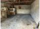 Inside a spacious garage/storage space with concrete walls and floors at 514 Mary Ave, New Smyrna Beach, FL 32168