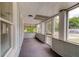The open porch with its original features offers views of the surrounding neighborhood at 514 Mary Ave, New Smyrna Beach, FL 32168