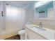 Bathroom featuring a shower and modern vanity with granite counters at 5476 W Bayshore Dr, Port Orange, FL 32127