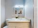 Bright bathroom featuring a white vanity, modern fixtures, and a shower with white tile at 5476 W Bayshore Dr, Port Orange, FL 32127