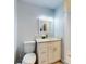 Bright bathroom featuring a white vanity, modern fixtures, and a shower with white tile at 5476 W Bayshore Dr, Port Orange, FL 32127