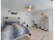 Comfortable bedroom with wood floors, a ceiling fan, and great decor at 5476 W Bayshore Dr, Port Orange, FL 32127