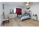 Comfortable bedroom with wood floors, a ceiling fan, and great decor at 5476 W Bayshore Dr, Port Orange, FL 32127