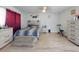 Comfortable bedroom with wood floors, a ceiling fan, and great decor at 5476 W Bayshore Dr, Port Orange, FL 32127