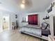 Comfortable bedroom with wood floors, a ceiling fan, and great decor at 5476 W Bayshore Dr, Port Orange, FL 32127