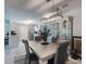 Open dining room with china cabinet next to the kitchen at 5476 W Bayshore Dr, Port Orange, FL 32127