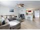 Open-concept living room with modern finishes, wood-look flooring, and plenty of natural light at 5476 W Bayshore Dr, Port Orange, FL 32127