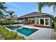 Beautiful backyard featuring a large pool, covered patio, and plenty of space for entertaining at 6294 W Fallsgrove Ln, Port Orange, FL 32128