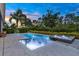 Backyard view of pool and lush landscaping at 6294 W Fallsgrove Ln, Port Orange, FL 32128