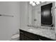 Granite countertop and fixtures complement the updated bathroom with sleek, modern features at 6294 W Fallsgrove Ln, Port Orange, FL 32128