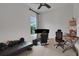 Neutral room with modern furniture, a ceiling fan and natural light from a window at 6294 W Fallsgrove Ln, Port Orange, FL 32128
