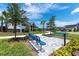 A beautifully landscaped community area featuring seating, green spaces, and well-maintained surroundings at 6294 W Fallsgrove Ln, Port Orange, FL 32128