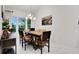 Elegant dining room with large windows and modern lighting at 6294 W Fallsgrove Ln, Port Orange, FL 32128