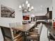 Formal dining room with a view to the kitchen and living room at 6294 W Fallsgrove Ln, Port Orange, FL 32128