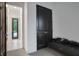 Hallway with neutral decor, dark doors and a bench seat at 6294 W Fallsgrove Ln, Port Orange, FL 32128