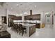 Gourmet kitchen with an oversized island and stainless steel appliances for Gathering dining at 6294 W Fallsgrove Ln, Port Orange, FL 32128