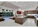 Open-concept kitchen featuring an island, modern appliances, pendant lighting, and a view to the backyard at 6294 W Fallsgrove Ln, Port Orange, FL 32128