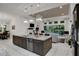 Modern kitchen with large island and open to the living room at 6294 W Fallsgrove Ln, Port Orange, FL 32128