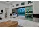 The open-concept living room features marble floors and seamless access to the outdoor kitchen at 6294 W Fallsgrove Ln, Port Orange, FL 32128