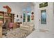Stylish home office featuring natural light, office furniture, and a sitting area at 6294 W Fallsgrove Ln, Port Orange, FL 32128