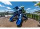 A vibrant blue playground with slides and equipment, offering a fun recreational space in the community at 6294 W Fallsgrove Ln, Port Orange, FL 32128