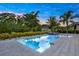 Sparkling pool with a spa and lush landscaping offers a private outdoor oasis at 6294 W Fallsgrove Ln, Port Orange, FL 32128