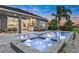 Backyard oasis featuring a sparkling pool, spa and an outdoor kitchen and dining area at 6294 W Fallsgrove Ln, Port Orange, FL 32128