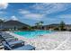 Community pool with ample seating, sunny skies, and well-maintained pool deck for a refreshing outdoor experience at 6294 W Fallsgrove Ln, Port Orange, FL 32128