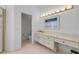 Bright bathroom includes vanity area, toilet, and a shower for maximum accessibility at 6325 Palmas Bay Cir, Port Orange, FL 32127