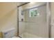 Modern bathroom featuring glass shower with window and contemporary fixtures at 6325 Palmas Bay Cir, Port Orange, FL 32127