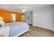 Well-lit bedroom featuring wood floors and ample closet space at 6325 Palmas Bay Cir, Port Orange, FL 32127